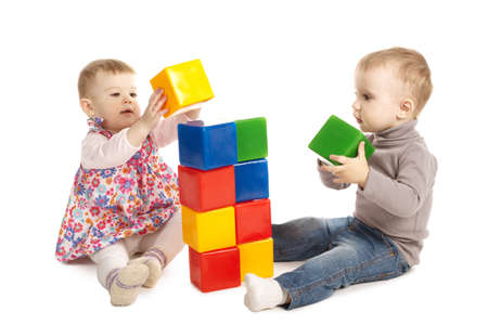boy and girl playing with cubesの写真素材