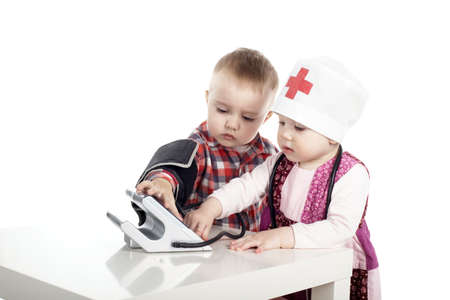boy and girl playing with tonometerの写真素材