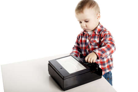 inquisitive little boy turns switches on deviceの写真素材