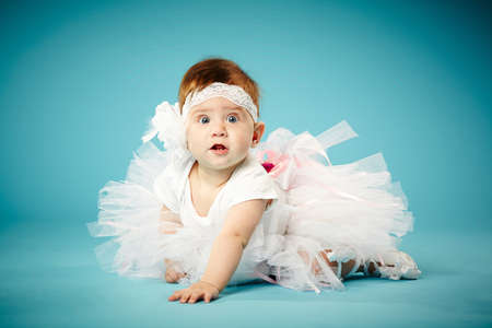 cute little ballerina on blue backgroundの写真素材
