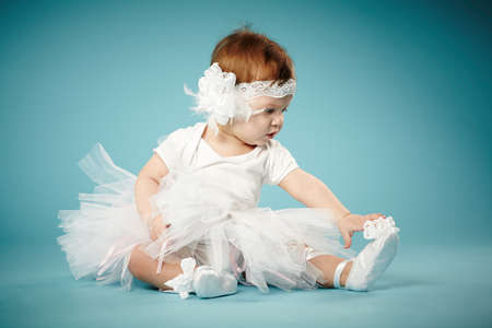 cute little ballerina on blue backgroundの写真素材