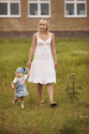 mother with daughter in summer parkの写真素材