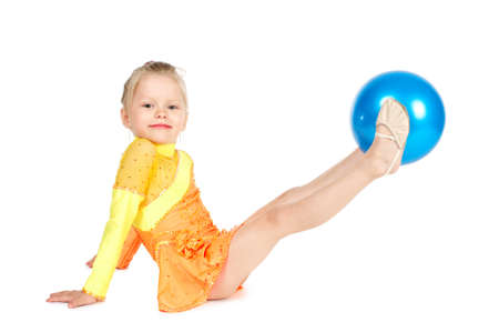 Beautiful girl gymnast with a ball isolated on whiteの写真素材