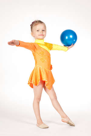 Beautiful girl gymnast with a ballの写真素材