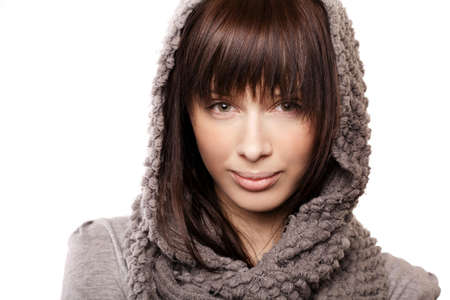 beautiful girl with knitted scarf portrait isolated on whiteの写真素材