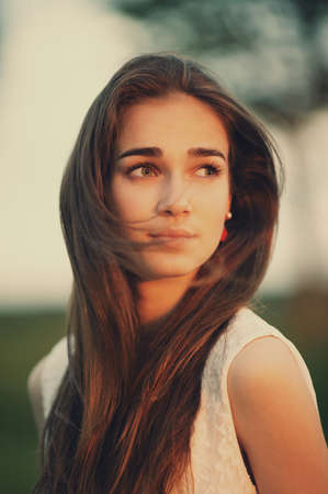 young beautiful girl with long hair portraitの写真素材