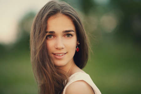young beautiful girl with long hair portraitの写真素材