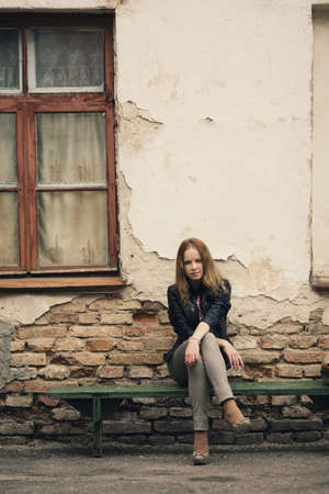 young geautiful blond girl street portraitの写真素材