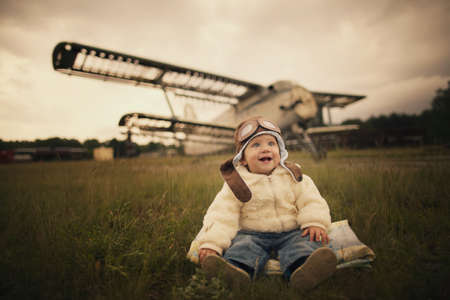 sweet little baby dreaming of being pilotの写真素材