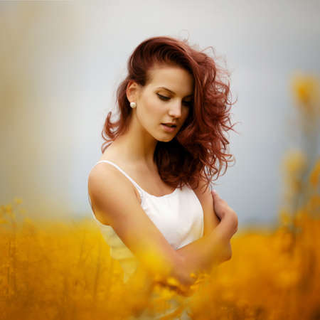 young beautiful girl in the fieldの写真素材