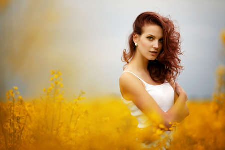 young beautiful girl in the fieldの写真素材