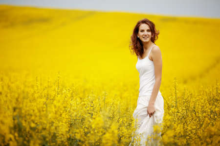 young beautiful girl in the fieldの写真素材