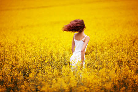 young beautiful girl in the fieldの写真素材
