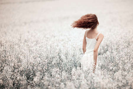 young beautiful girl in the fieldの写真素材