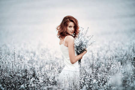 young beautiful girl in the fieldの写真素材