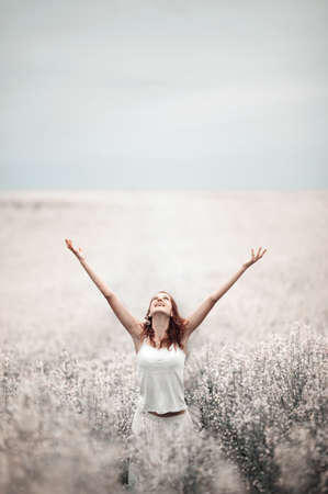 young beautiful girl in the fieldの写真素材