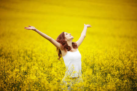 young beautiful girl in the fieldの写真素材