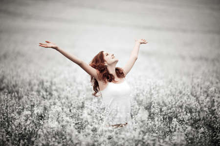 young beautiful girl in the fieldの写真素材