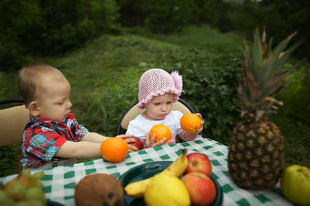 cute boy and girl on picnic in parkの写真素材