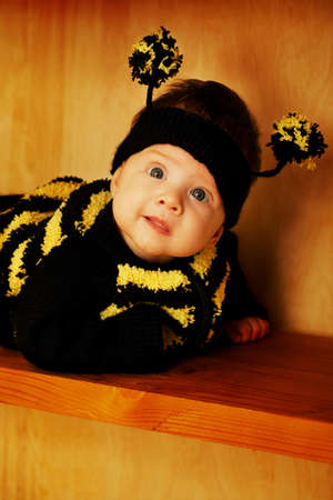 little funny baby with bee costumeの写真素材