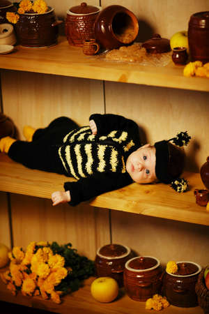 little funny baby with bee costumeの写真素材