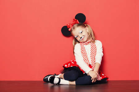 little beautiful girl with mouse maskの写真素材