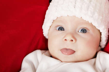 cute happy baby shows tongue