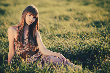 Beautiful young girl with long hair portraitの写真素材