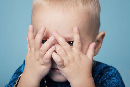 Little funy boy plays hide and seekの写真素材