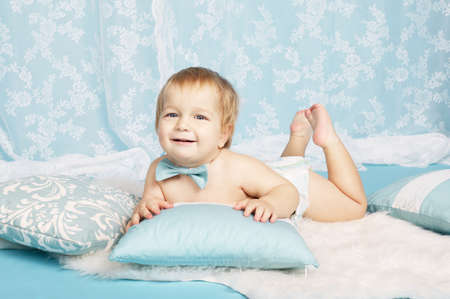 cute boy lying on floor portraitの写真素材