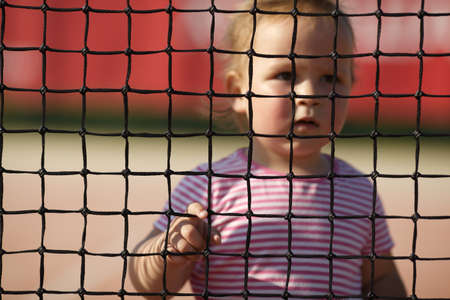 little funny girl plays tennis