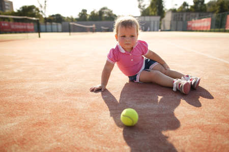 little funny girl plays tennisの写真素材