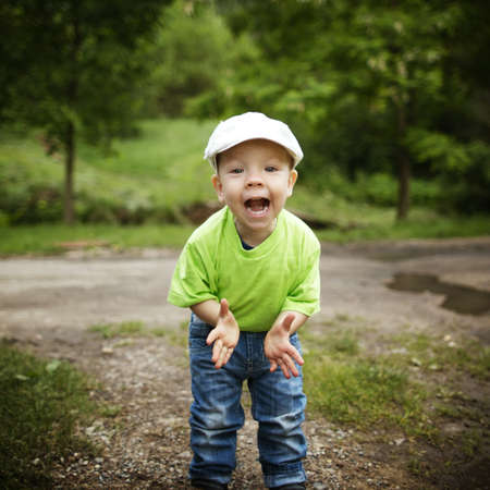 Amazed or surprised boy outside portraitの写真素材