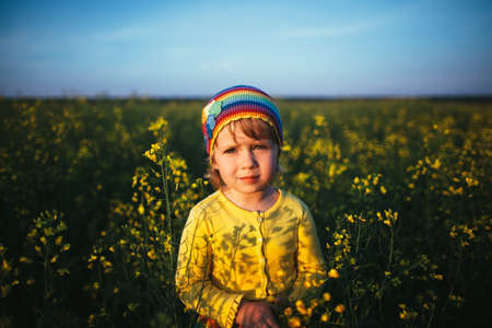 cute little girl on meadow