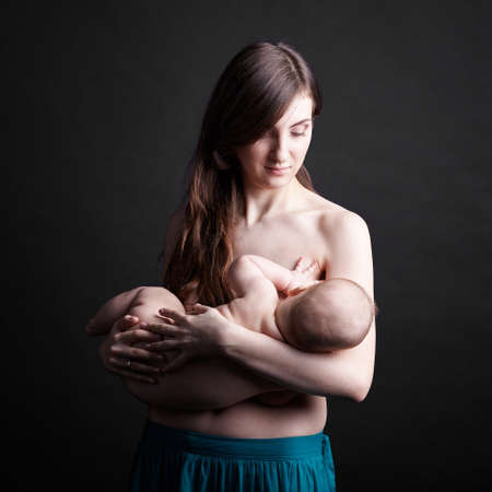 Mother breast feeding her infantの写真素材