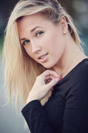 beautiful blonde girl portrait on the street