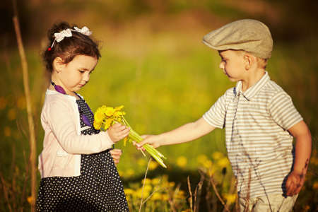 boy and girl in summer fieldの写真素材