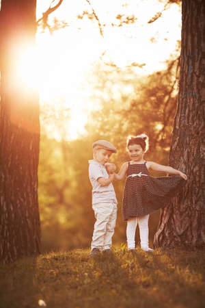 lovely boy and girl on sunset