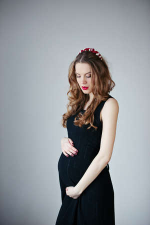 beautiful pregnant woman at home portraitの写真素材