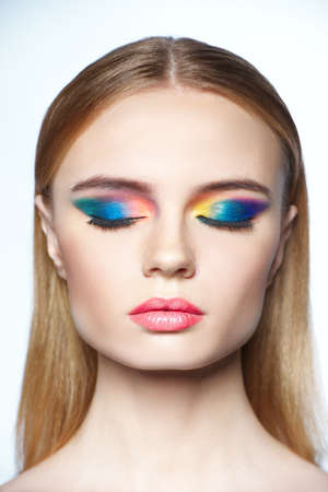 beautiful girl studio portrait on bright backgroundの写真素材