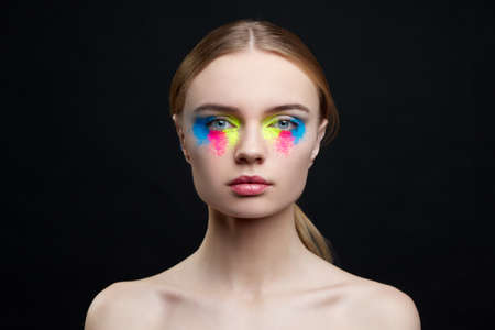 beautiful girl studio portrait on bright backgroundの写真素材