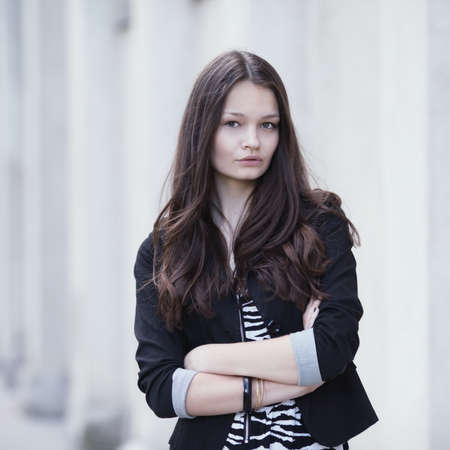 beautiful serious girl urban portrait on the streetの写真素材