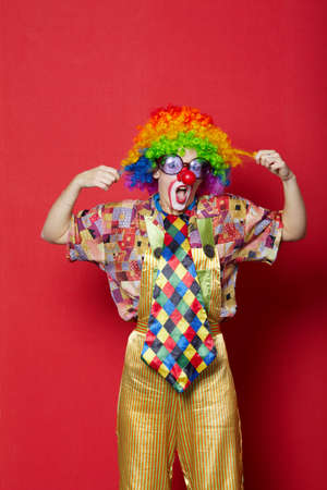 funny clown with glasses on red backround