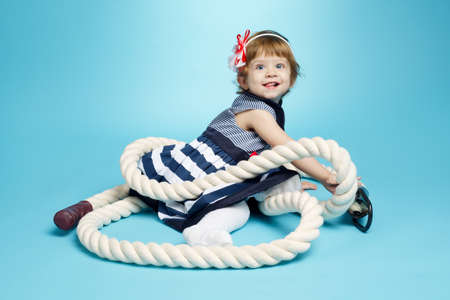 cute little sailor baby on blue background