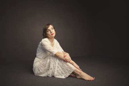 photo of beautiful girl on dark backgroundの写真素材