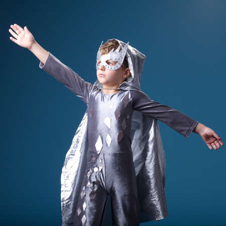 little funny super hero boy studio portraitの写真素材