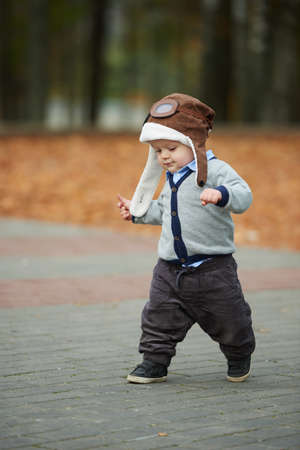 little cute boy in helmet pilot portrait