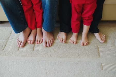photo of barefoot family feet at home
