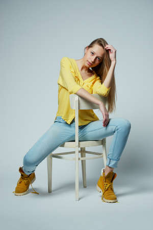 beautiful girl with long hair posing in studioの写真素材