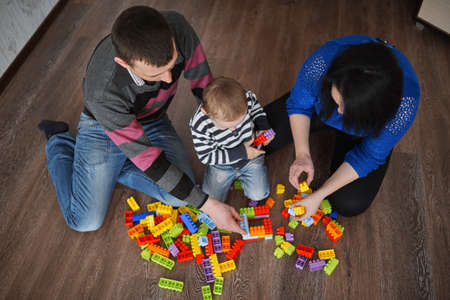 happy family play with cubes at home